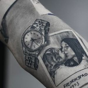 Black and gray Rolex crown watch